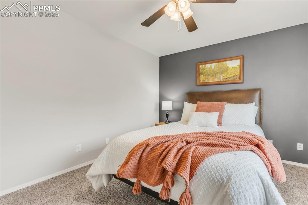 10467 Pictured Rocks Drive Peyton, CO 80831 - Photo 27 of 47 a bedroom with a bed and painting on the wall