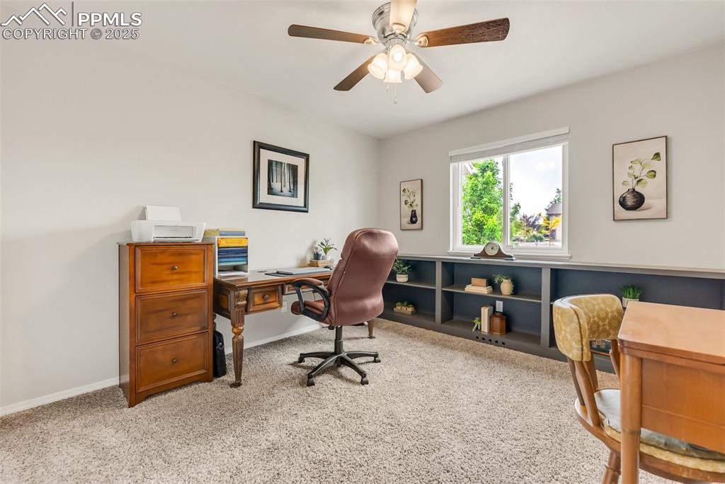 10467 Pictured Rocks Drive Peyton, CO 80831 - Photo 30 of 47 a view of a workspace with furniture and a window
