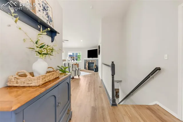 a dining room with furniture and a wooden floor