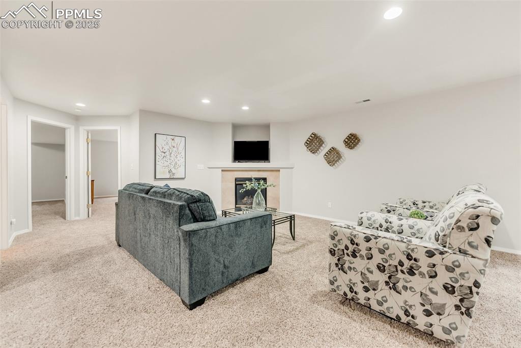 10467 Pictured Rocks Drive Peyton, CO 80831 - Photo 33 of 47 a living room with furniture and a flat screen tv