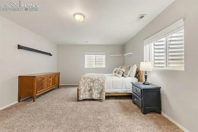 a bed room with a bed and a window