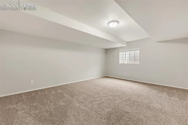 an empty room with a empty space and windows