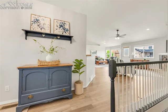 a view of a hallway with dining area