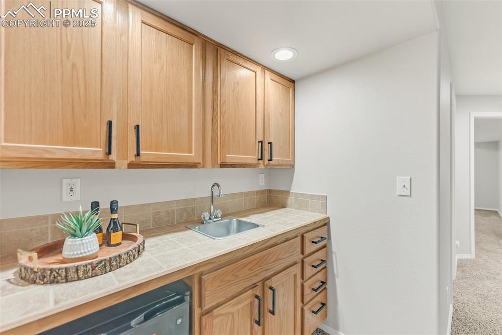 10467 Pictured Rocks Drive Peyton, CO 80831 - Photo 41 of 47 a bathroom with a sink a vanity and a mirror