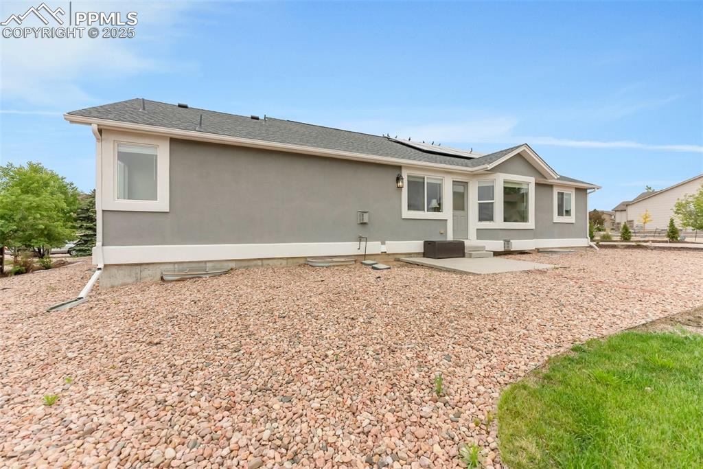 10467 Pictured Rocks Drive Peyton, CO 80831 - Photo 47 of 47 a front view of a house with a yard