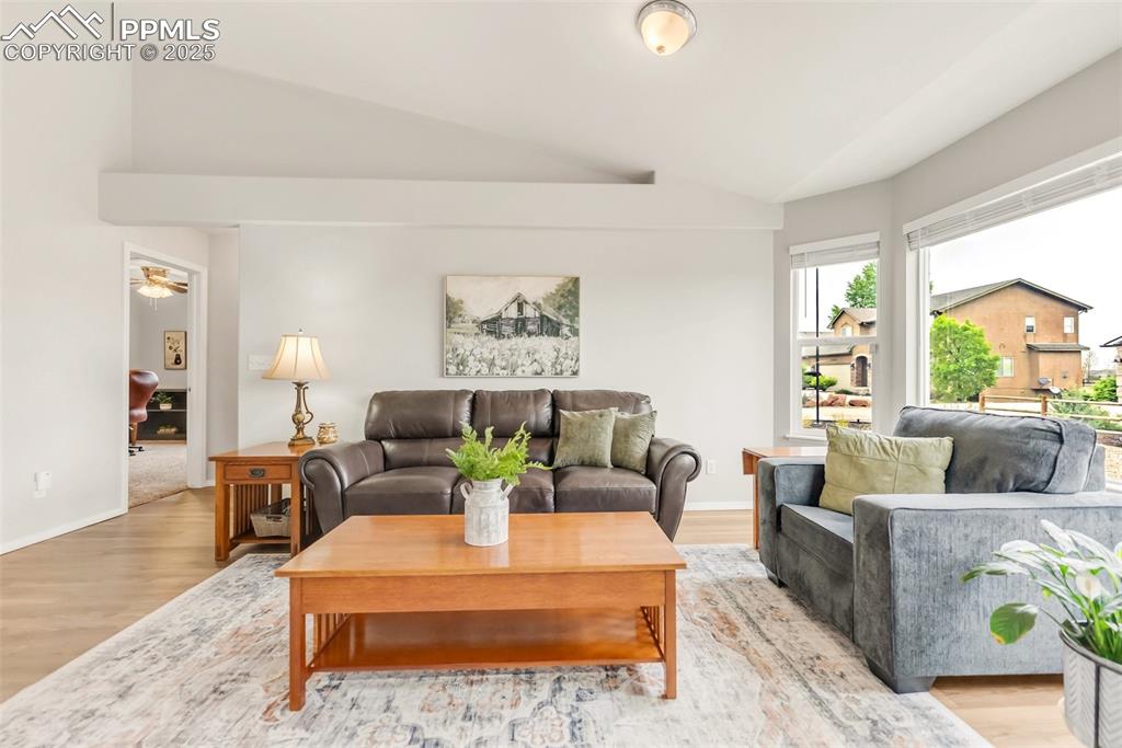 10467 Pictured Rocks Drive Peyton, CO 80831 - Photo 10 of 47 a living room with furniture and wooden floor