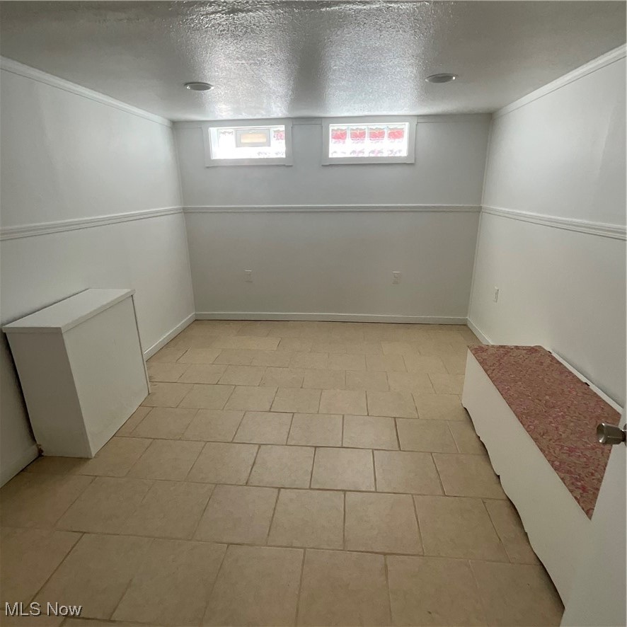 30401 Clarmont Road Willowick, OH 44095 - Photo 16 of 24 Below grade area with a textured ceiling and ornamental molding