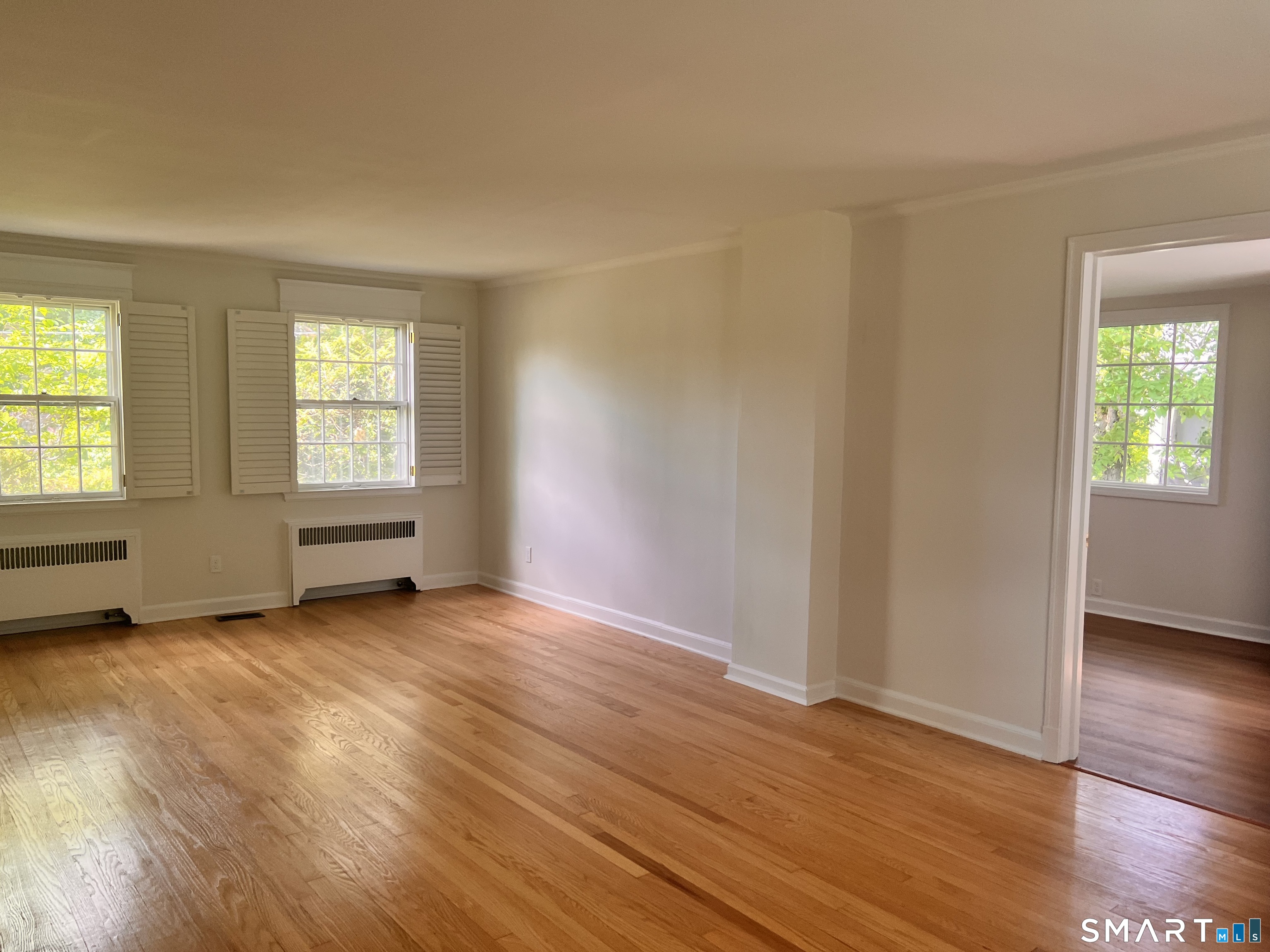23 Norway Road North Haven, CT 06473 - Photo 16 of 32 an empty room with wooden floor and windows