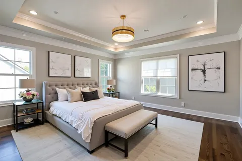 a view of a room with wooden floor and windows