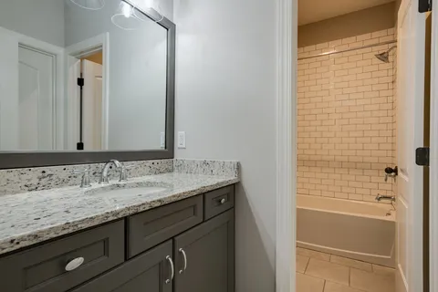a view of a patio with couches and potted plants