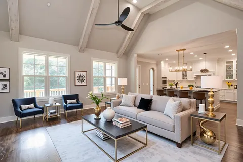 an empty room with wooden floor chandelier and windows