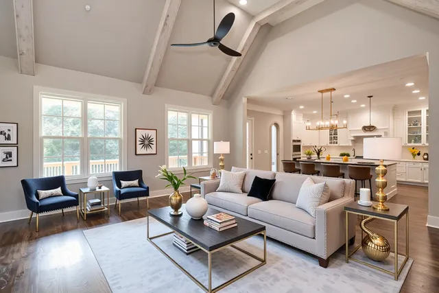 an empty room with wooden floor chandelier and windows