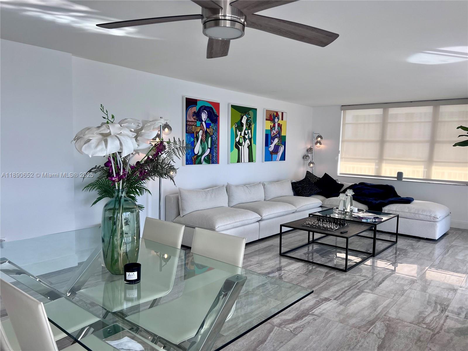 2851 Northeast 183rd Street, Unit 1017E Aventura, FL 33160 - Photo 17 of 46 a living room with furniture and a potted plant