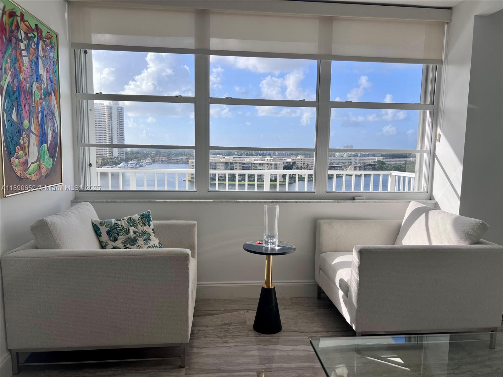 2851 Northeast 183rd Street, Unit 1017E Aventura, FL 33160 - Photo 19 of 46 a living room with furniture and a window