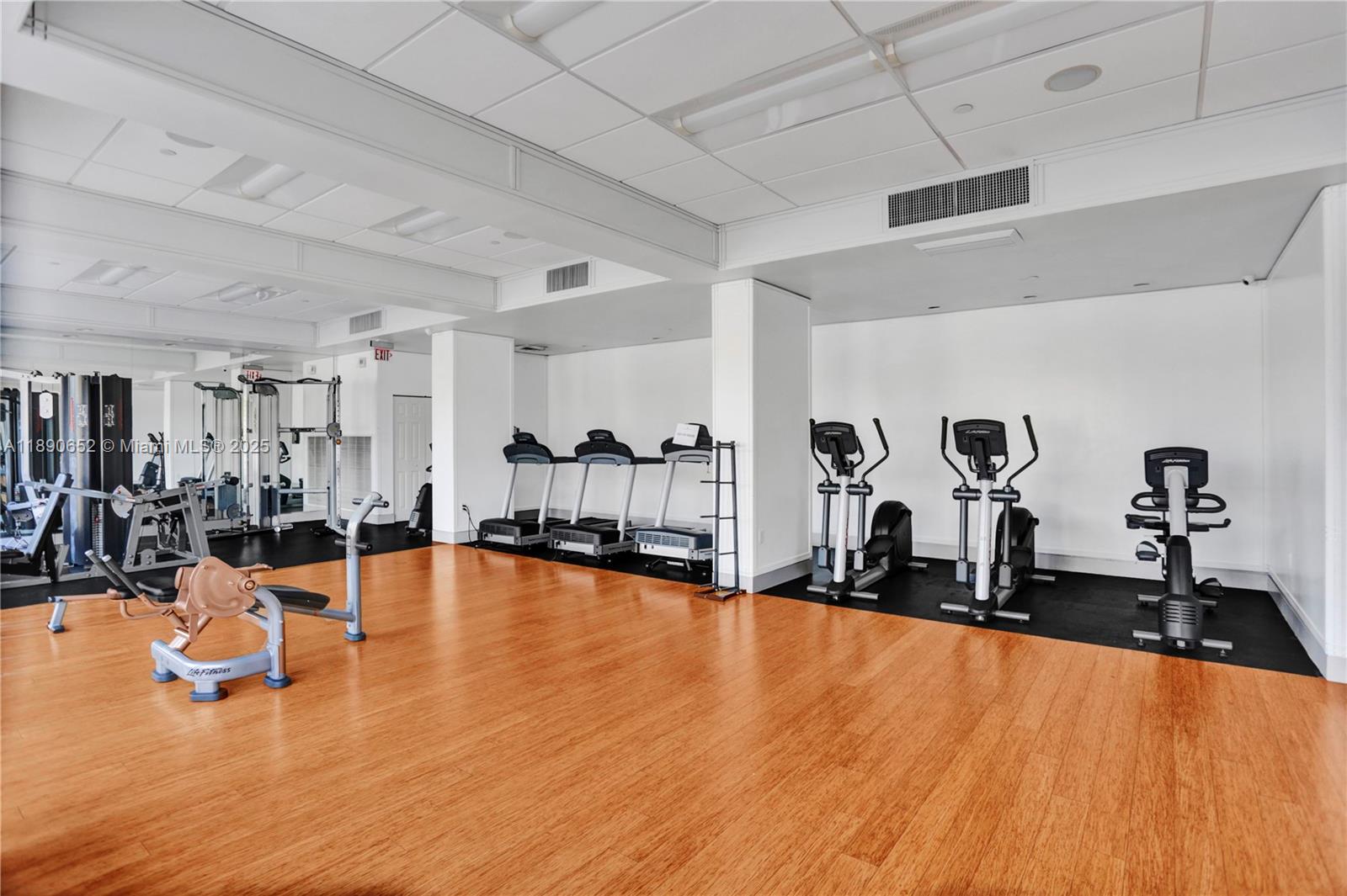 2851 Northeast 183rd Street, Unit 1017E Aventura, FL 33160 - Photo 32 of 46 a view of a living room with gym equipment