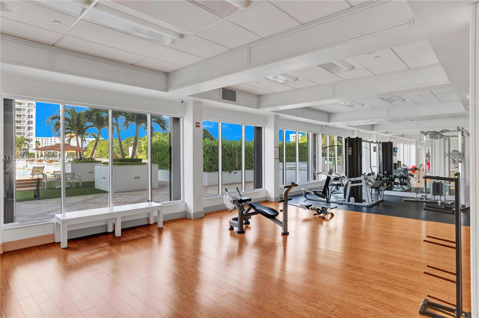 2851 Northeast 183rd Street, Unit 1017E Aventura, FL 33160 - Photo 33 of 46 a building with pool table and glass door