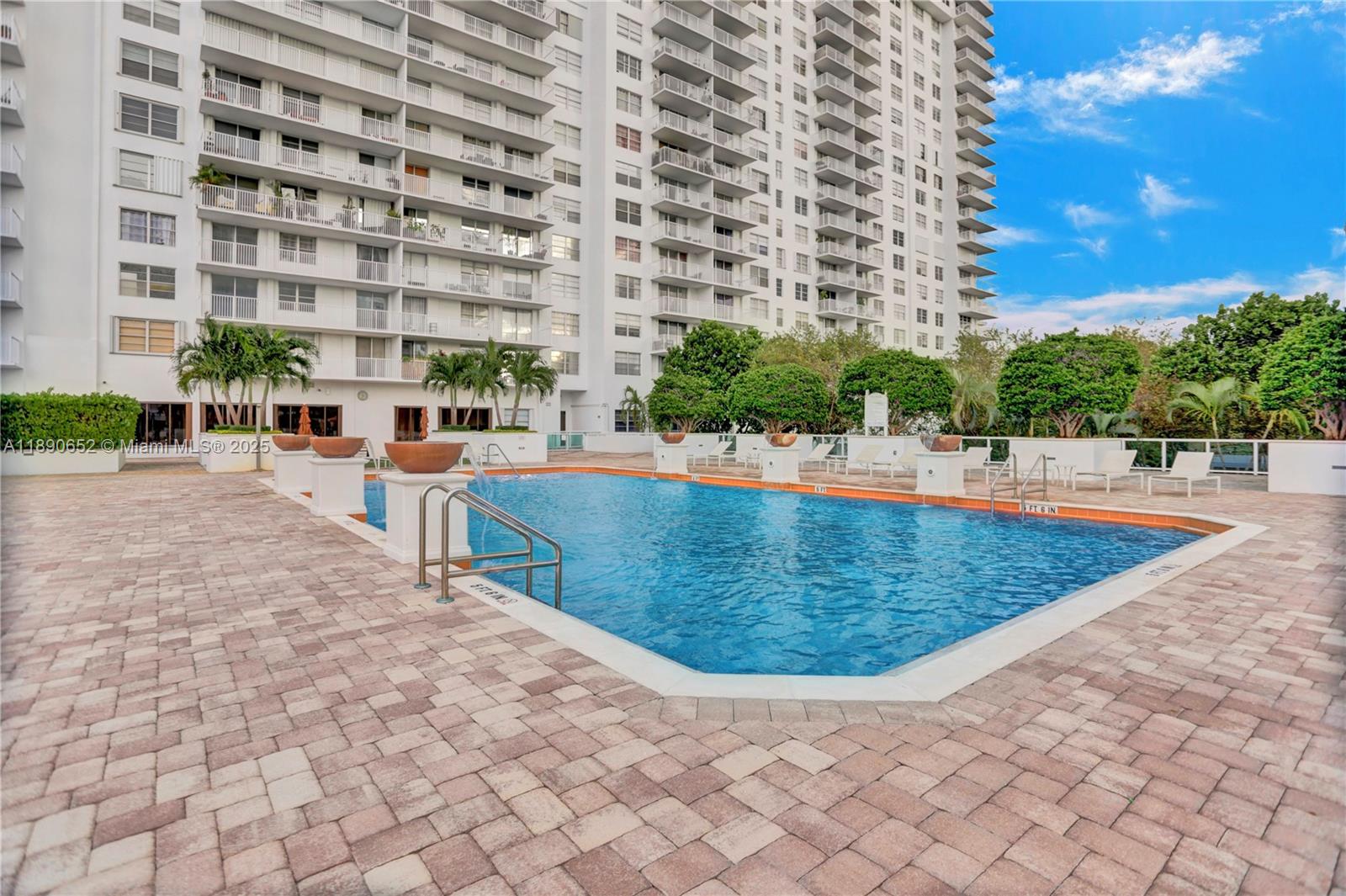 2851 Northeast 183rd Street, Unit 1017E Aventura, FL 33160 - Photo 37 of 46 swimming pool view with a outdoor space