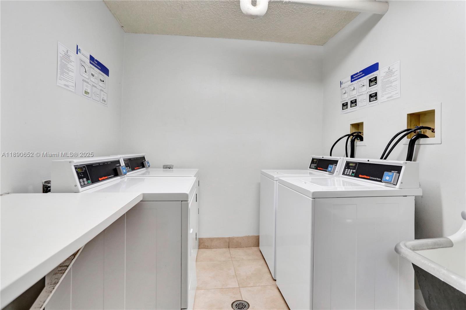 2851 Northeast 183rd Street, Unit 1017E Aventura, FL 33160 - Photo 46 of 46 a utility room with dryer and washer