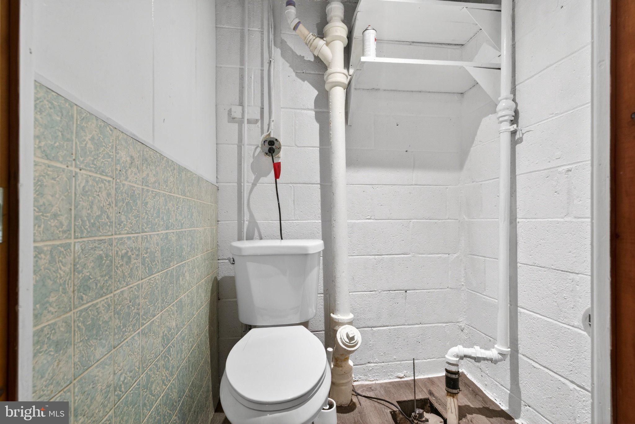 7729 Charlesmont Road Baltimore, MD 21222 - Photo 33 of 38 Compact bathroom with essential fixtures.