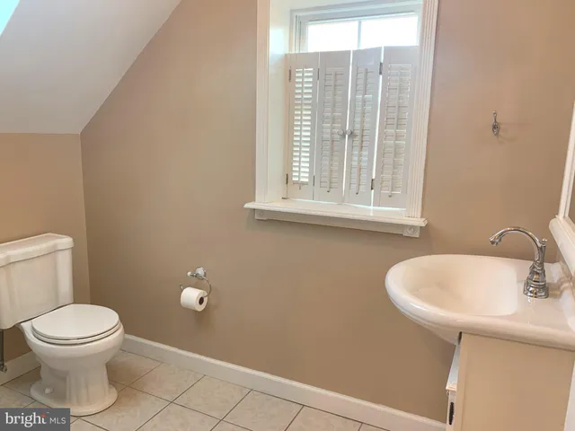 a bathroom with a toilet and shower