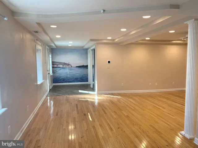 a view of kitchen with cabinets and wooden floor