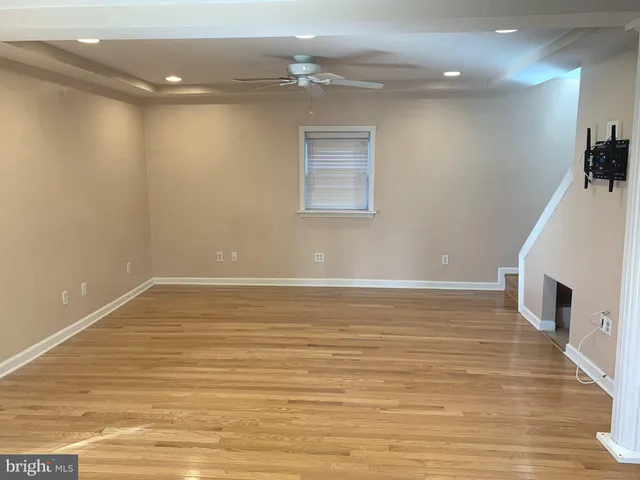 a kitchen with granite countertop a sink cabinets and stainless steel appliances