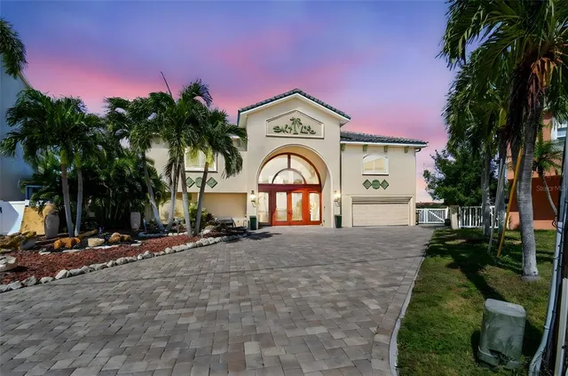 a view of a house with a yard and tree s