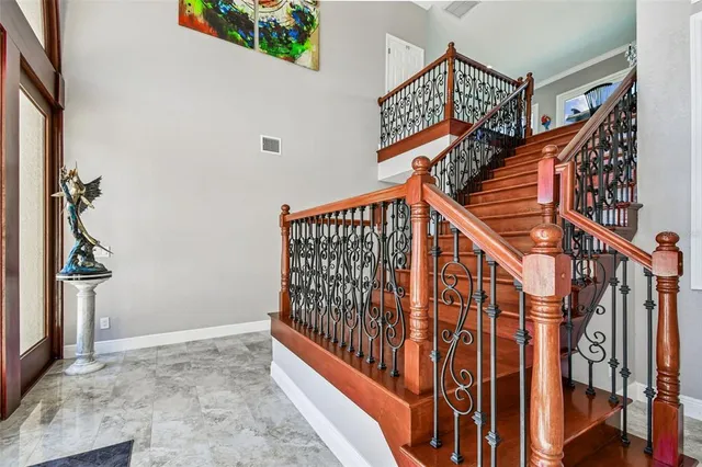 a large kitchen with stainless steel appliances granite countertop a lot of counter space and a sink