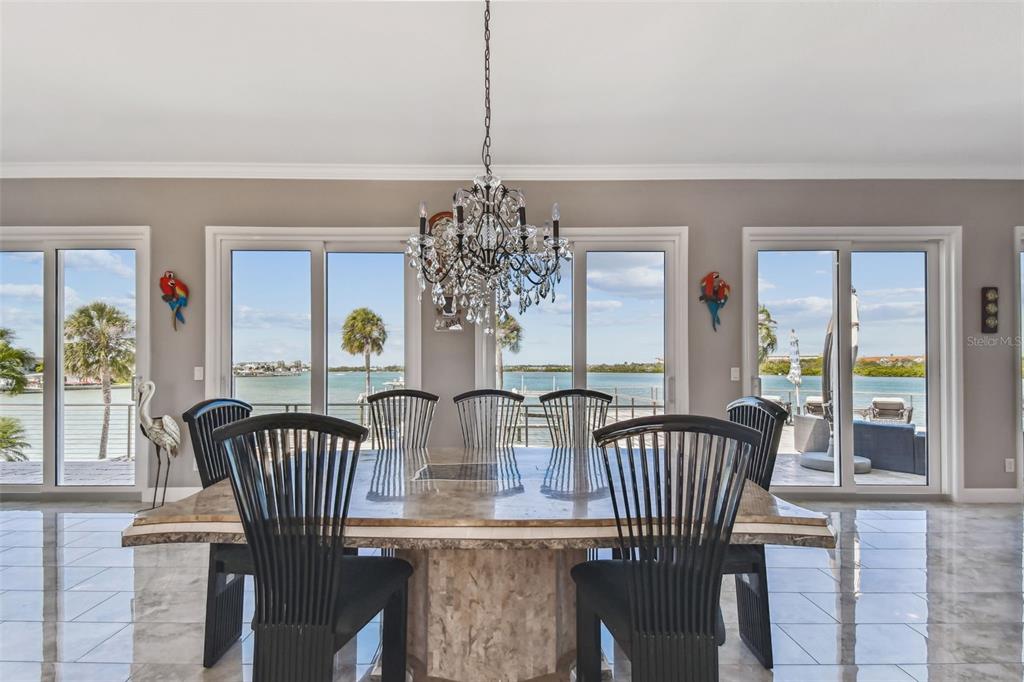 582 Johns Pass Avenue Madeira Beach, FL 33708 - Photo 15 of 100 a view of a dining room with furniture window and outside view