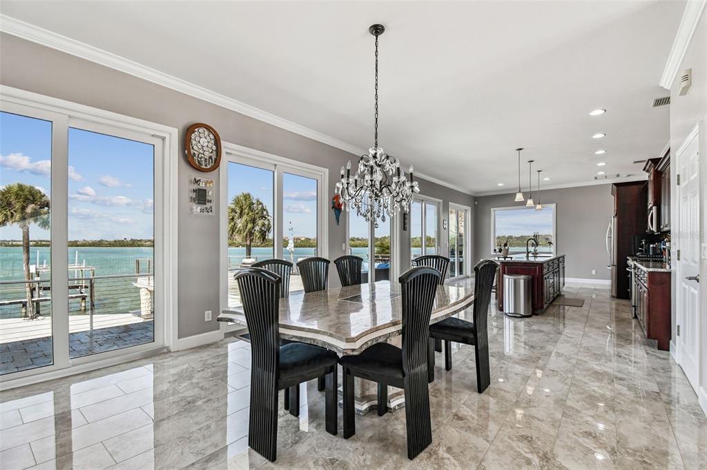 582 Johns Pass Avenue Madeira Beach, FL 33708 - Photo 16 of 100 a view of a dining room with furniture window and outside view