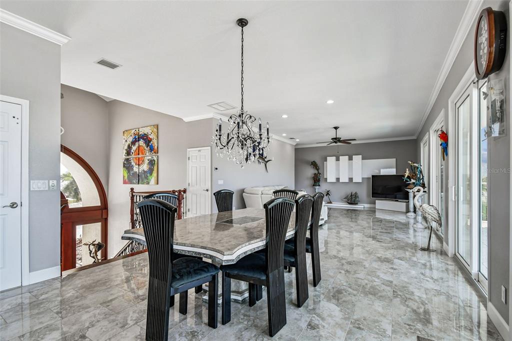582 Johns Pass Avenue Madeira Beach, FL 33708 - Photo 18 of 100 a view of a dining room with furniture