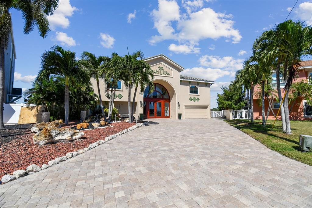 582 Johns Pass Avenue Madeira Beach, FL 33708 - Photo 3 of 100 a view of a house with a yard and tree s