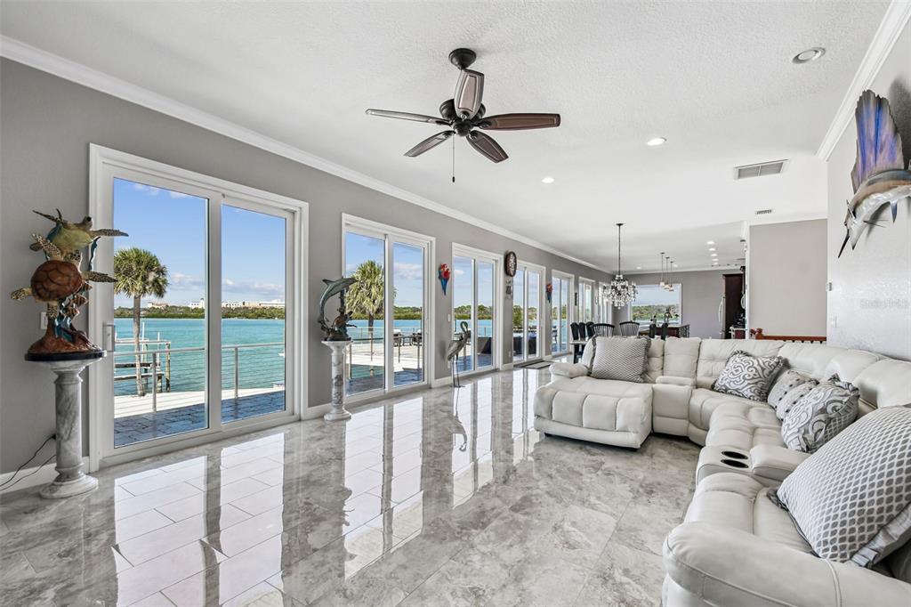 582 Johns Pass Avenue Madeira Beach, FL 33708 - Photo 31 of 100 a living room with furniture and a large window