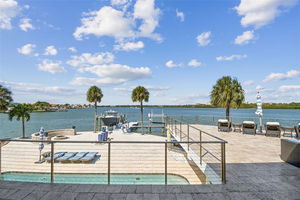 582 Johns Pass Avenue Madeira Beach, FL 33708 - Photo 32 of 100 a view of a lake with couches and city view