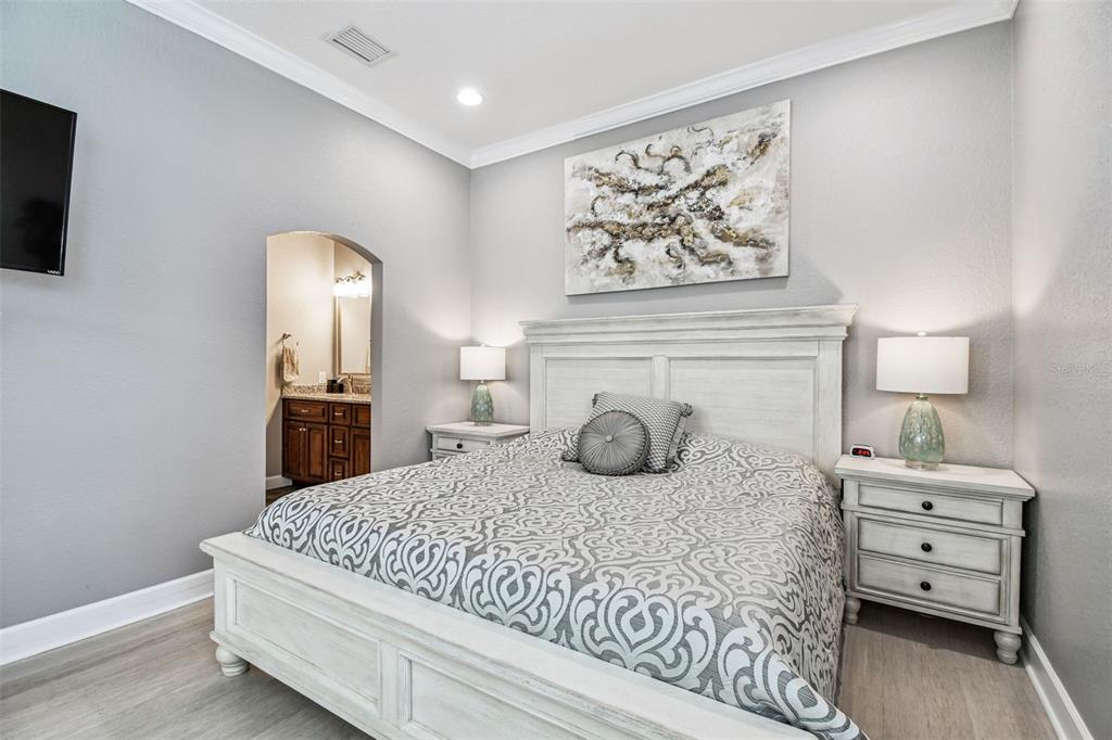 582 Johns Pass Avenue Madeira Beach, FL 33708 - Photo 55 of 100 a bedroom with a bed and a television