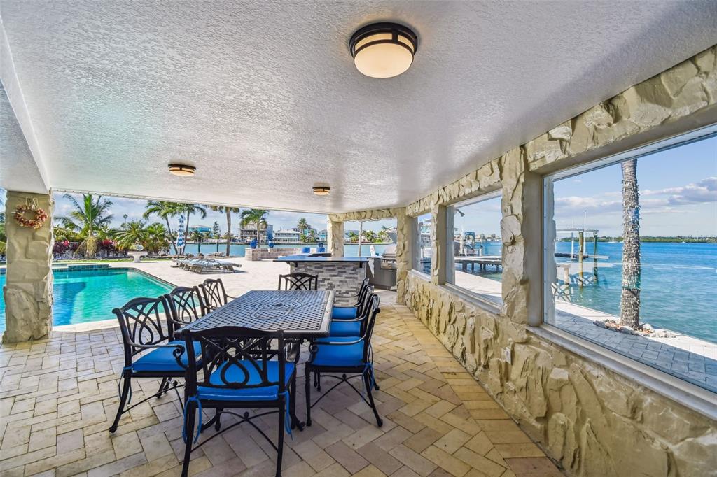 582 Johns Pass Avenue Madeira Beach, FL 33708 - Photo 92 of 100 a view of a dining room with furniture window and outside view