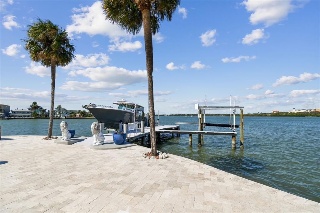 582 Johns Pass Avenue Madeira Beach, FL 33708 - Photo 98 of 100 a view of a lake with a table and chairs