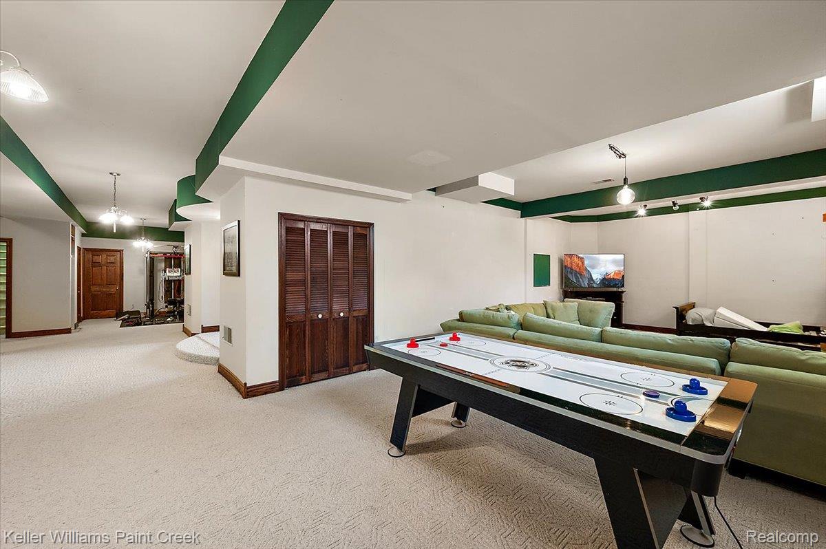 69069 Campground Road Romeo, MI 48065 - Photo 76 of 78 Spacious room featuring light-colored carpeting, white walls, and decorative green ceiling accents