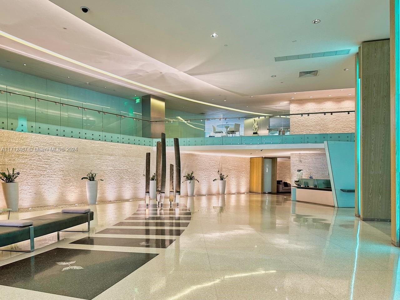 92 Southwest 3rd Street, Unit 4411 Miami, FL 33130 - Photo 12 of 17 a lobby with furniture and a rug