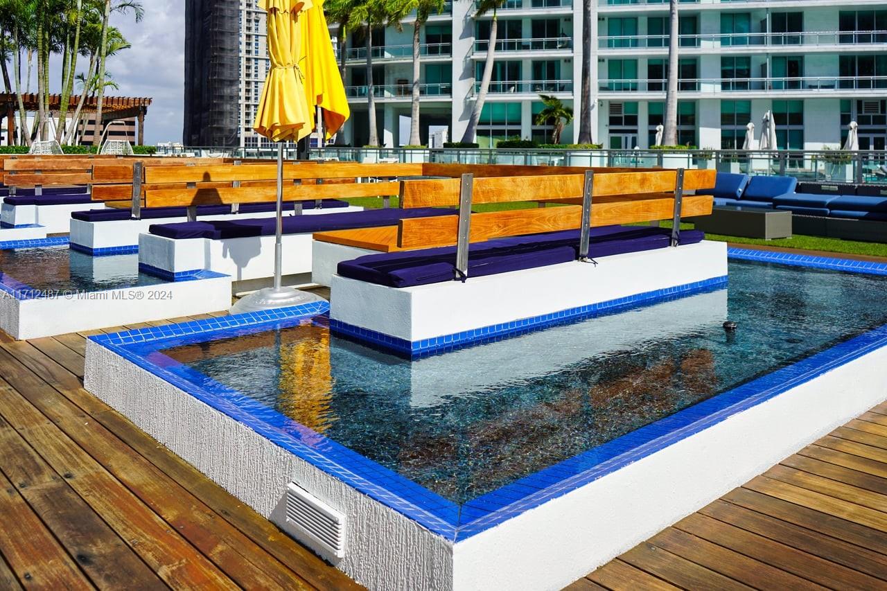 92 Southwest 3rd Street, Unit 4411 Miami, FL 33130 - Photo 3 of 17 swimming pool with outdoor seating