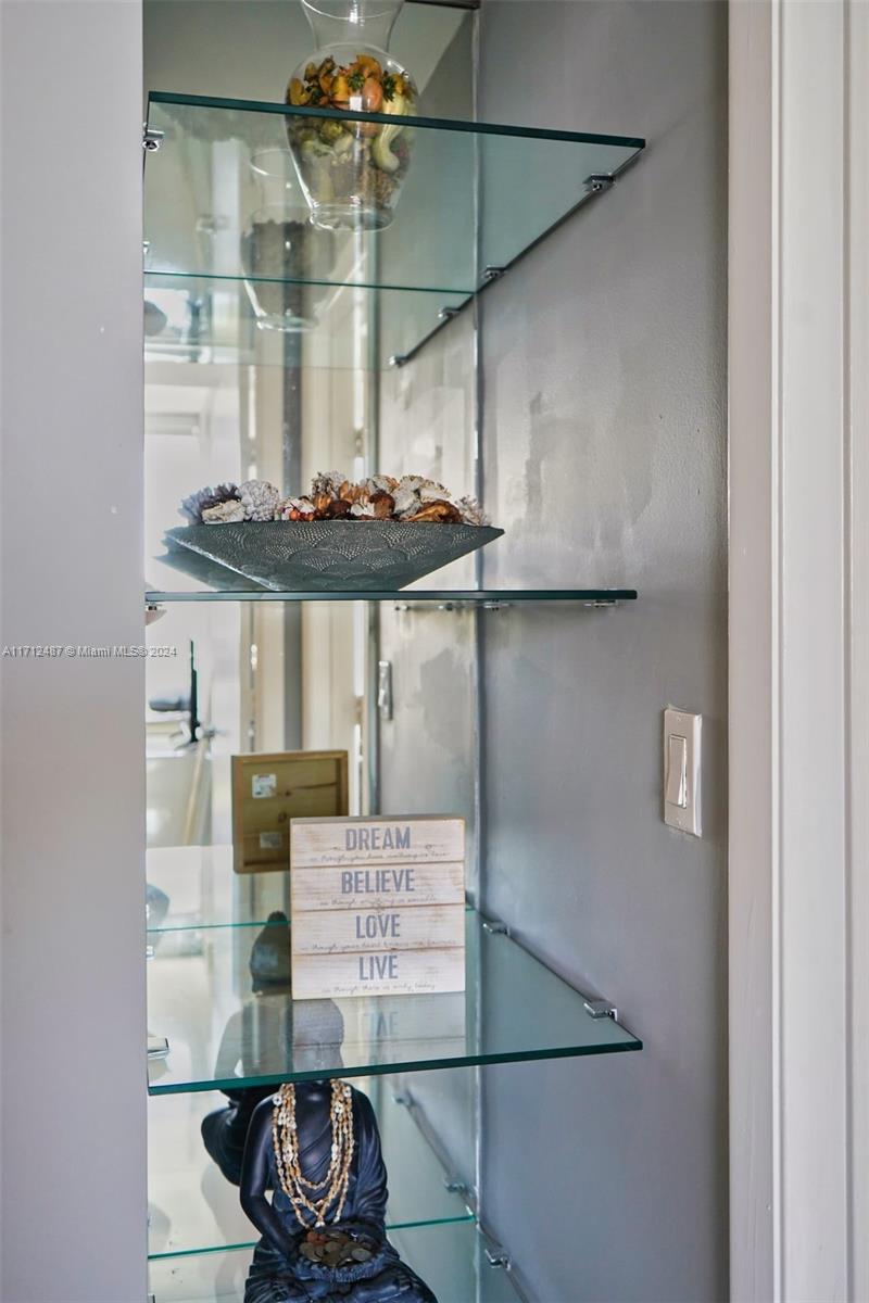 92 Southwest 3rd Street, Unit 4411 Miami, FL 33130 - Photo 10 of 17 a room with a table and chairs