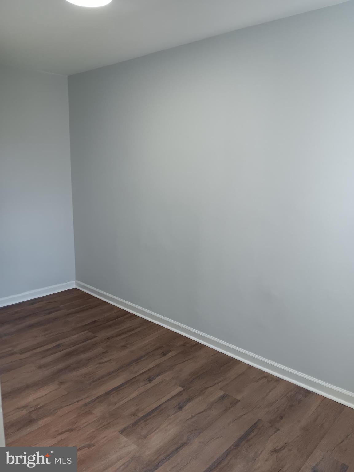 1012 Potter Street Chester, PA 19013 - Photo 12 of 19 a view of an empty room with wooden floor