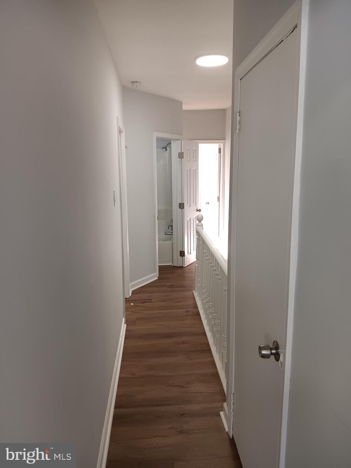1012 Potter Street Chester, PA 19013 - Photo 10 of 19 a view of a hallway with wooden floor and staircase