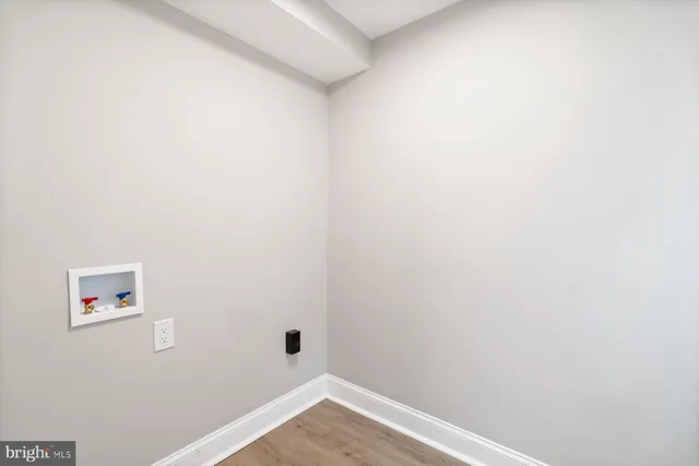 a view of a small space with wooden floor