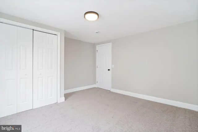 an empty room with a empty space and a window