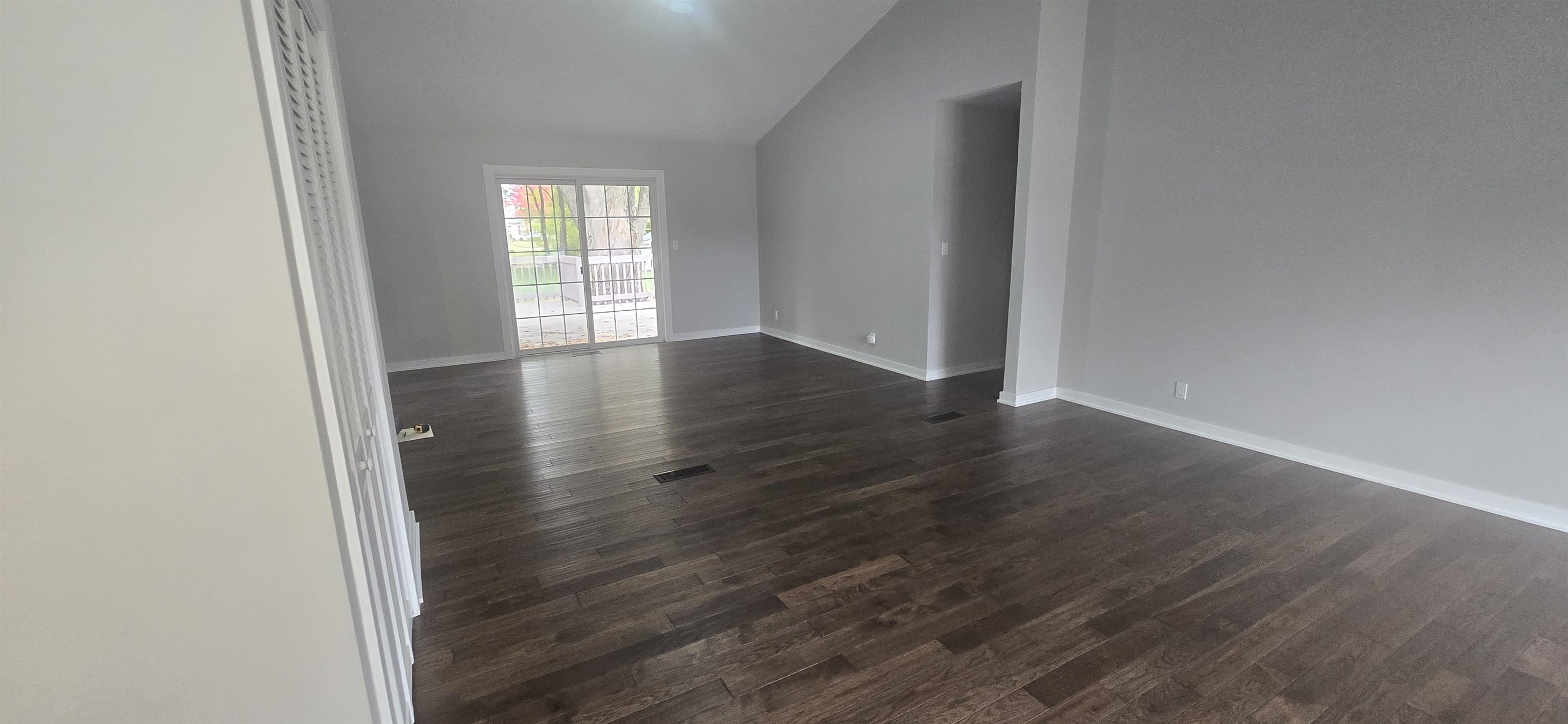 3606 Springwheat Street Rockford, IL 61114 - Photo 13 of 41 an empty room with wooden floor and windows