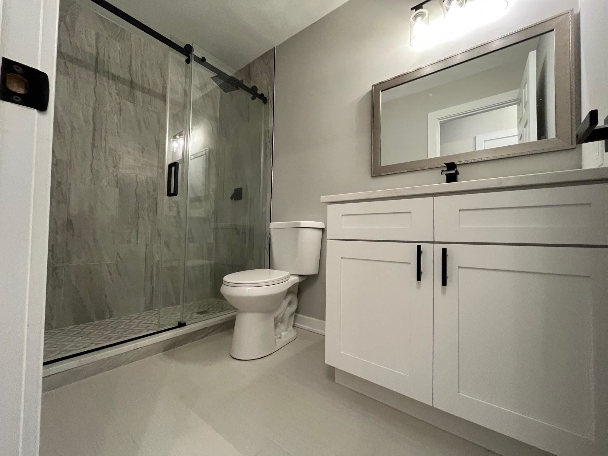 3606 Springwheat Street Rockford, IL 61114 - Photo 17 of 41 a white toilet sitting next to a bathroom sink