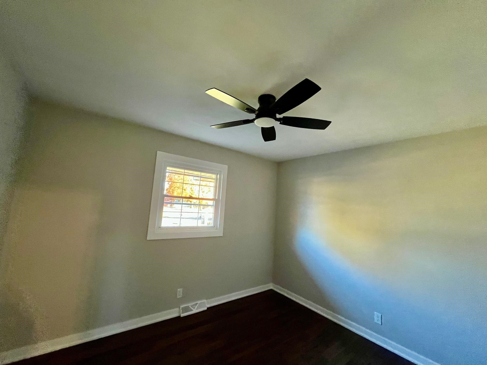 3606 Springwheat Street Rockford, IL 61114 - Photo 24 of 41 a view of a big room with wooden floor and windows