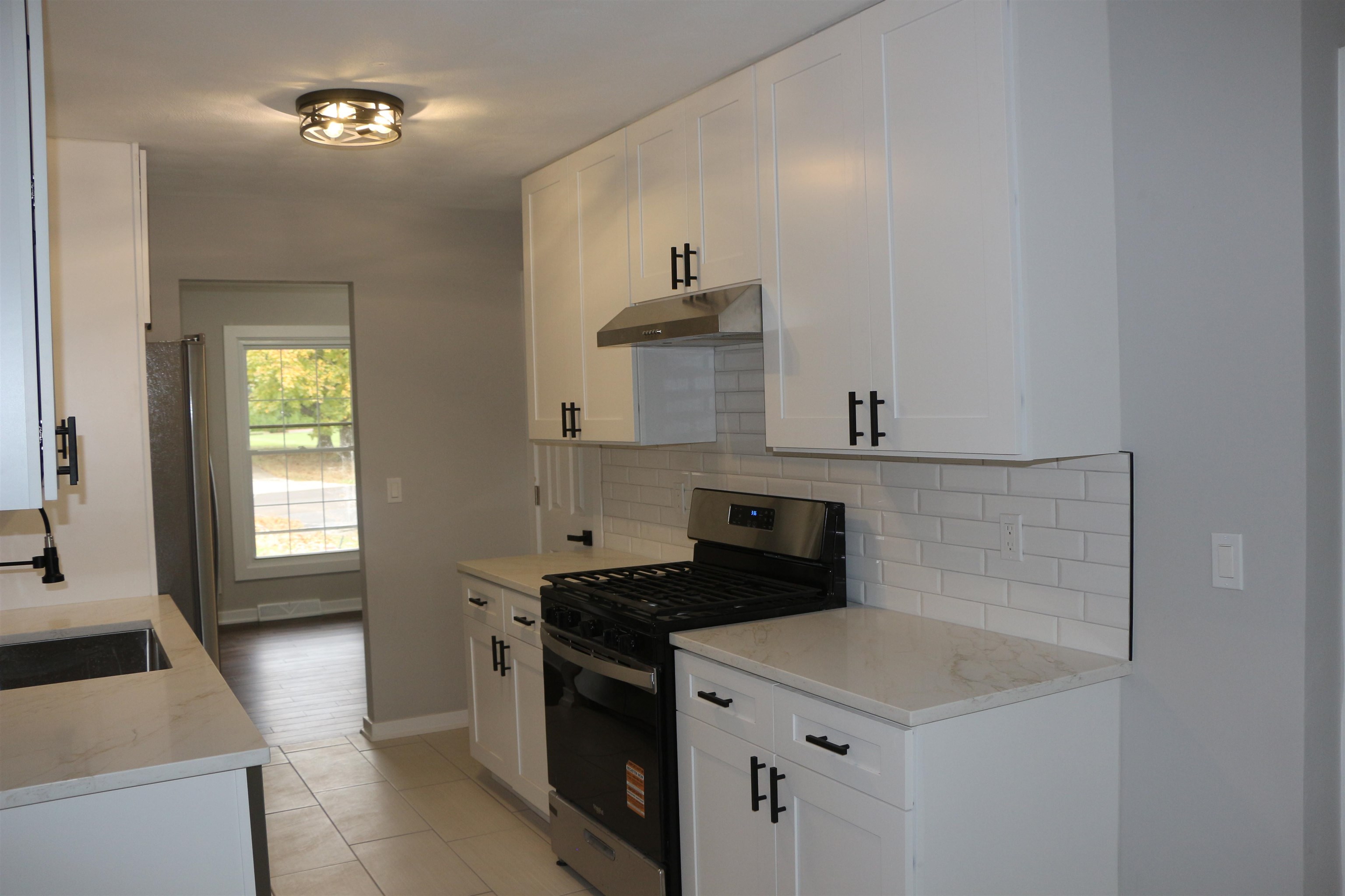 3606 Springwheat Street Rockford, IL 61114 - Photo 5 of 41 a kitchen with stainless steel appliances a sink dishwasher stove and refrigerator