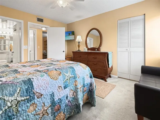 a bedroom with a bed and a couch